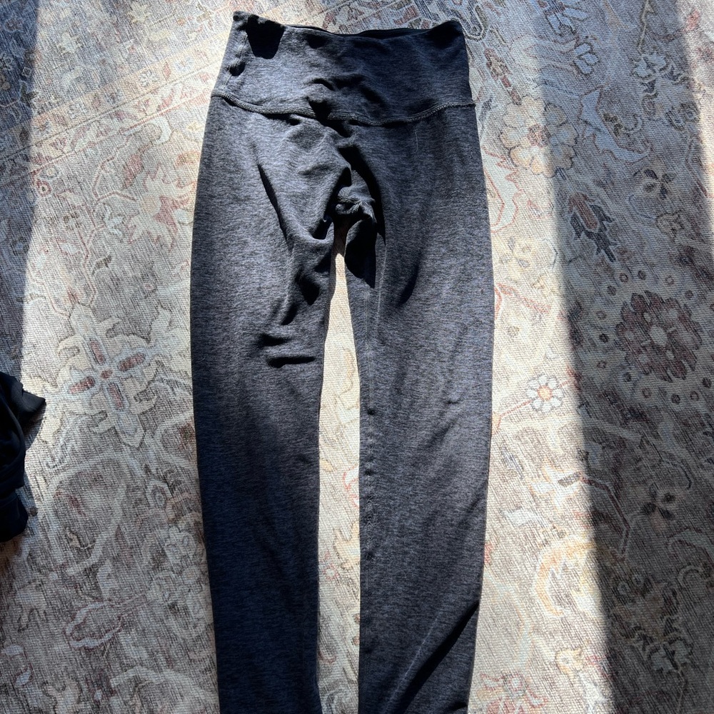 Beyond yoga legging in a heathered purple color